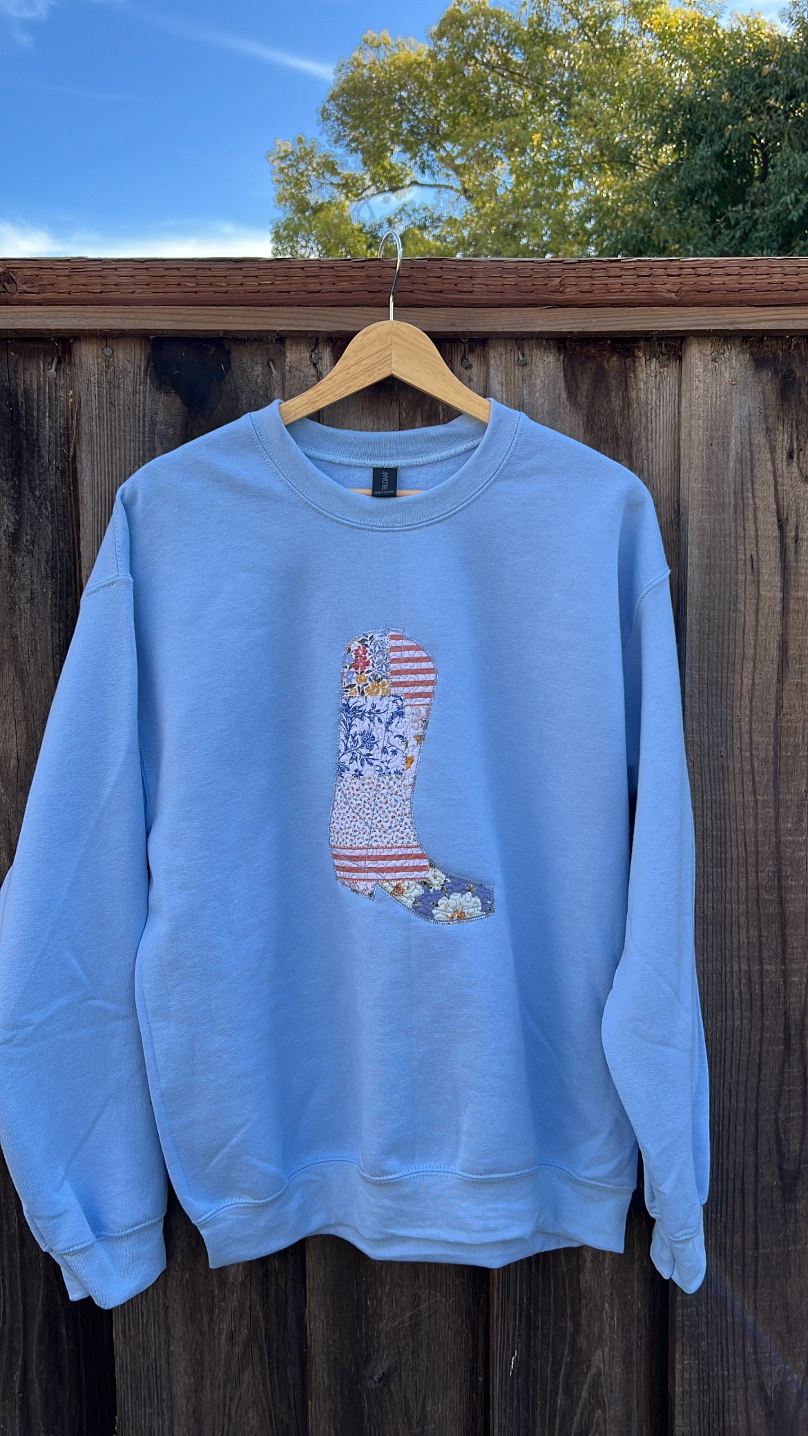 Light blue western sweatshirt with patchwork cowboy boot